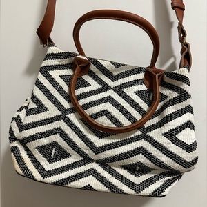 Medium sized white and black, Cross body with tan strap.